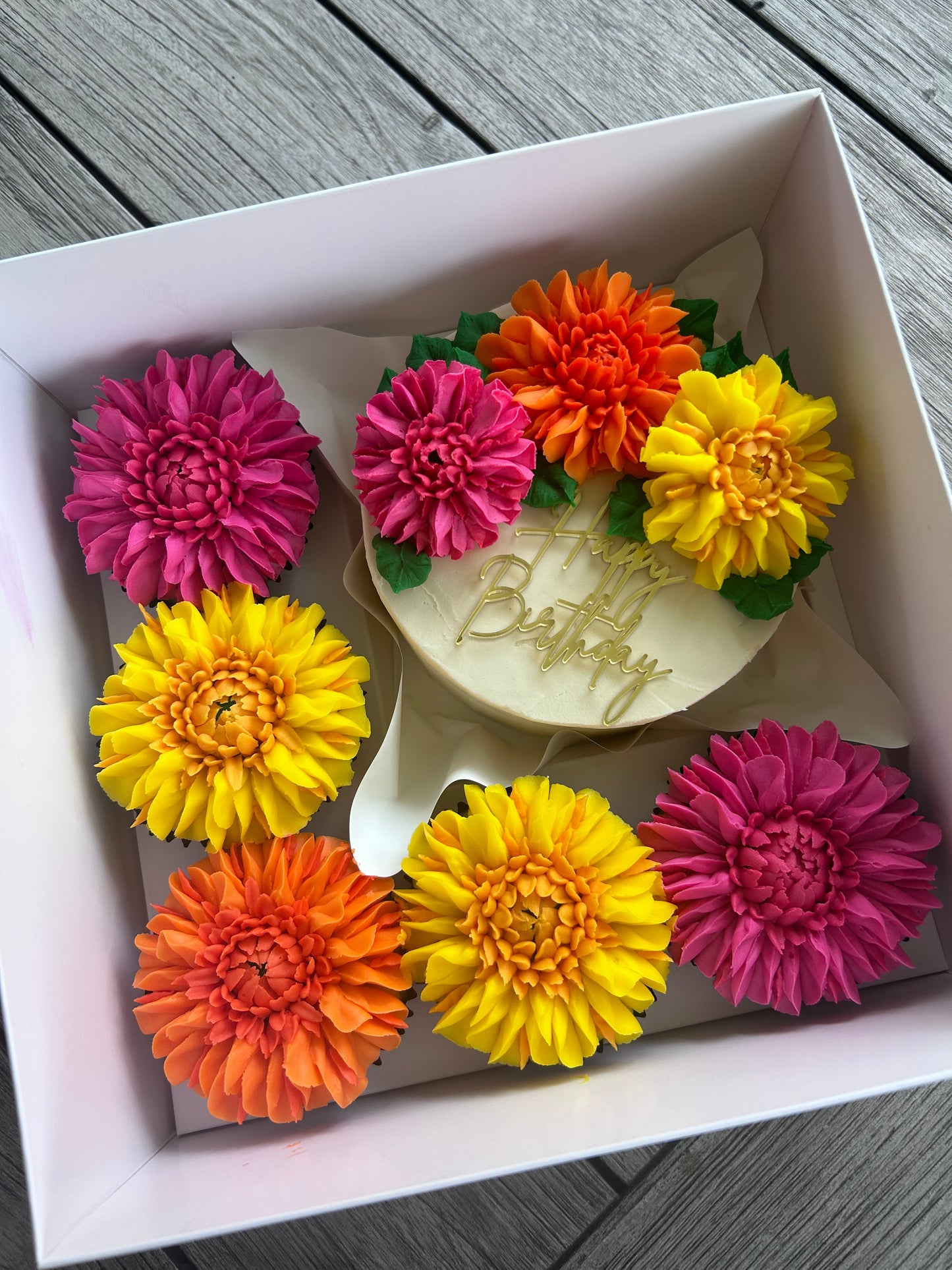 Bento box with a 5' cake and 5 cupcakes