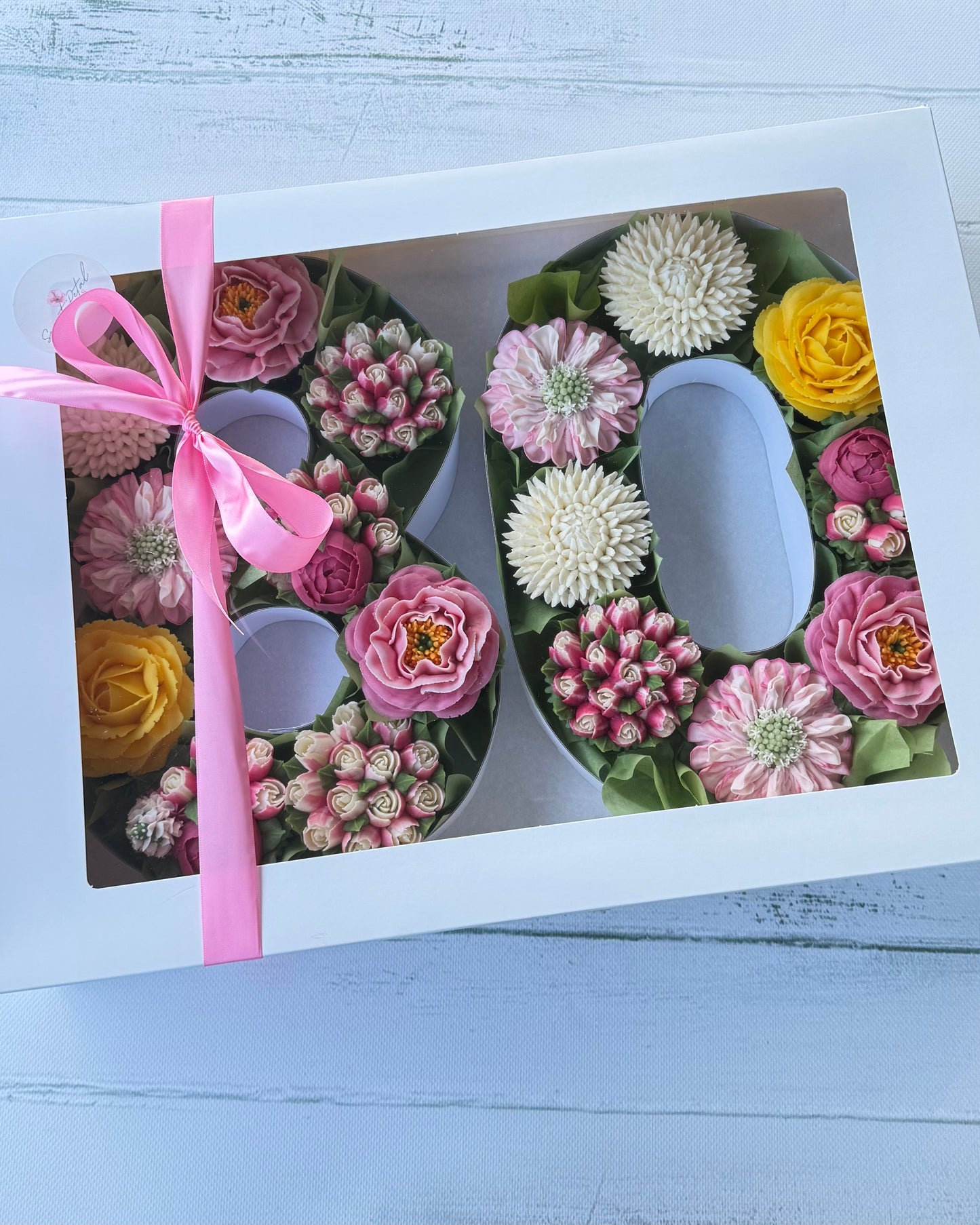 Floral cupcakes in number boxes