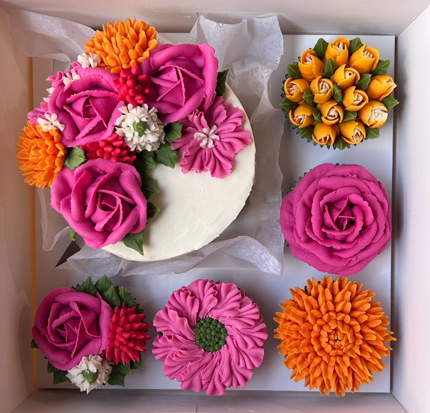 Bento box with cake and cupcakes