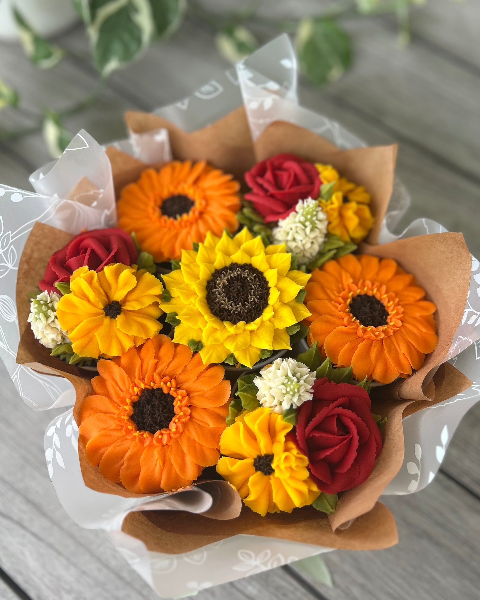 Bouquet of floral buttercream cupcakes in summer flowers