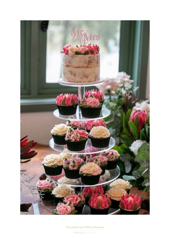 Wedding cake and cupcakes display