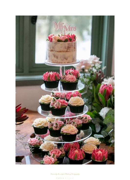 Wedding cake and cupcakes display
